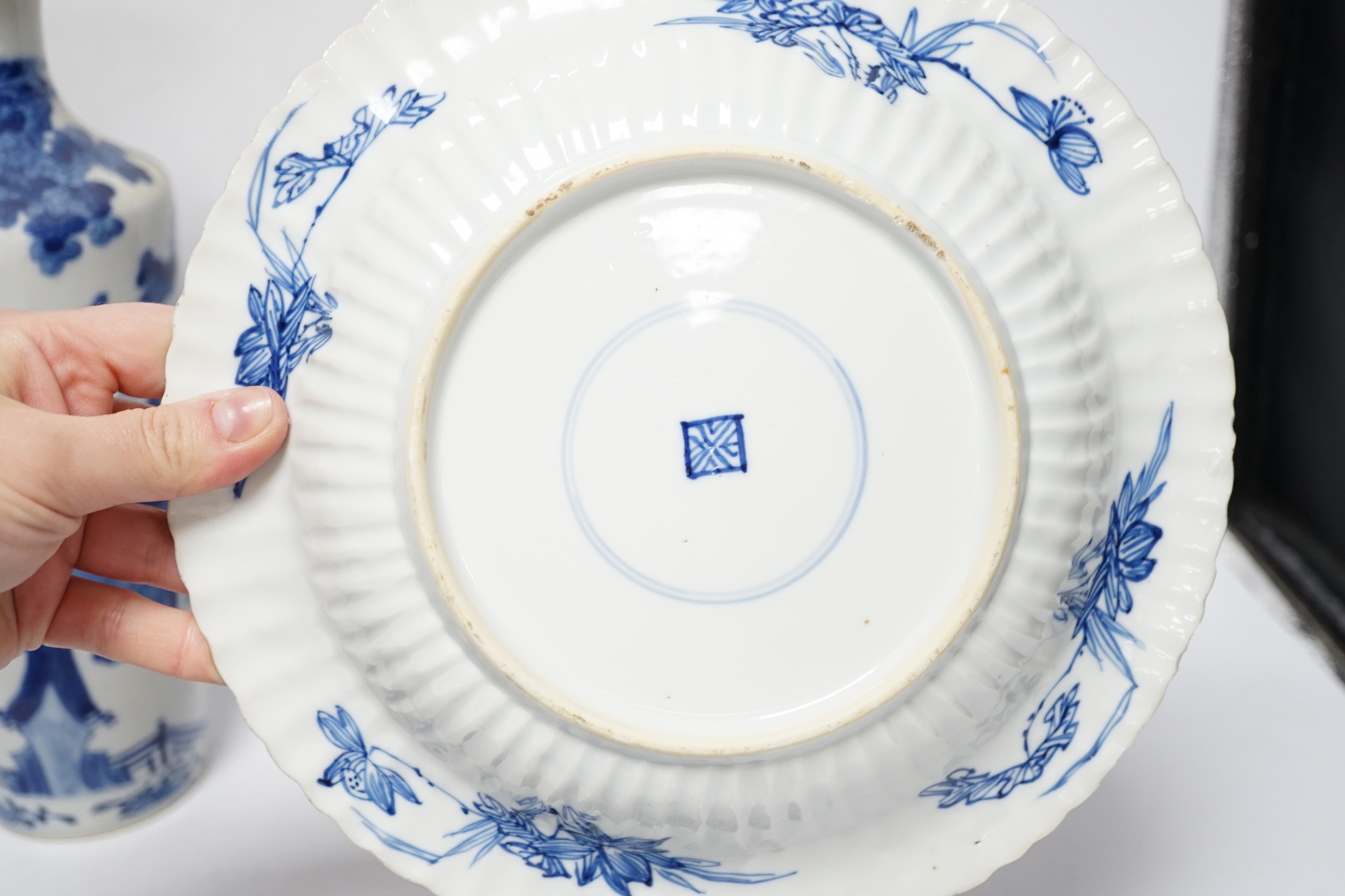 A group of Chinese blue and white dishes and plates and a damaged vase, 30cm